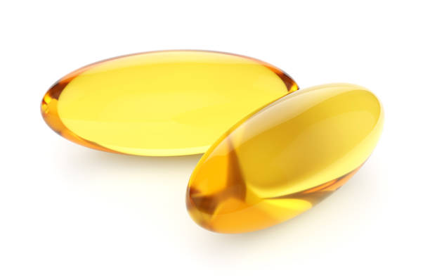 istock Two capsules Omega 3 isolated on white background 1164938735