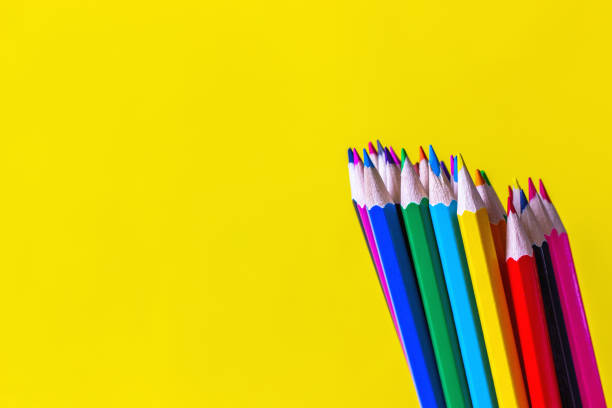 istock Color pencils on a bright yellow background. Back to school concept. Copy space for text. 1164940864