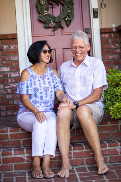 istock Mixed Race Senior Couple Sitting on Porch 1164943549
