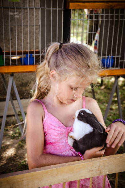 istock girl and bunny 1164945201
