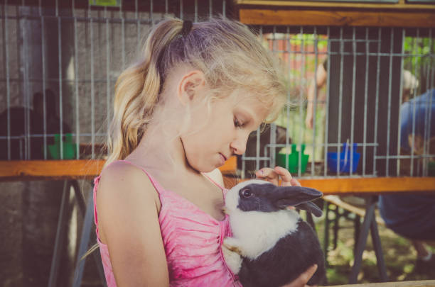 istock girl and bunny 1164945325