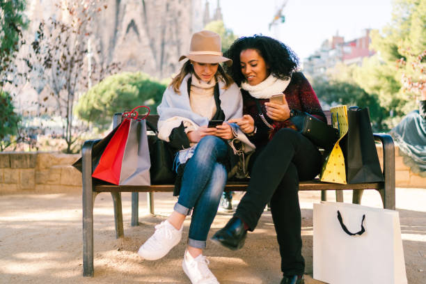 istock Friends after shopping checking social media 1164946423