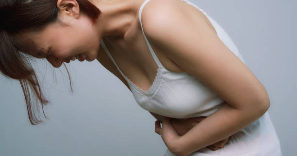istock Asian Woman Suffer From Stomachache 1164946986