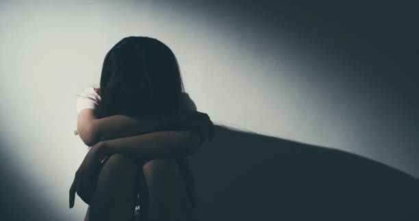 istock The Depression Woman Sit On The Floor 1164947224