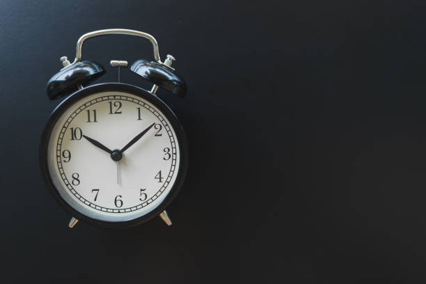 istock Close up vintage black alarm clock 1164948479