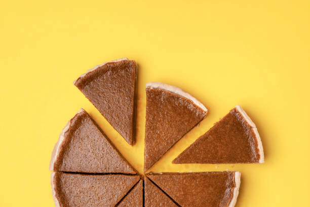 istock Traditional dessert flat lay. Sliced pumpkin pie close-up 1164955016