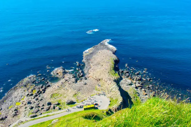 Photo of Giants Causeway Aerial view most popular and famous attraction in Northern Ireland.Hills on Coast of Atlantic ocean, summer time