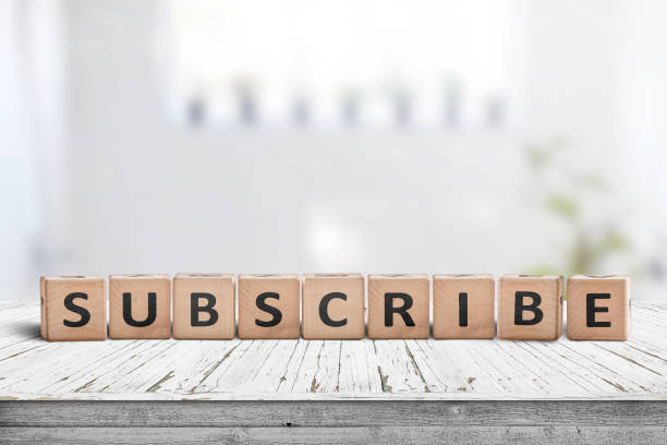 istock Subscribe word on a wooden sign 1164963761