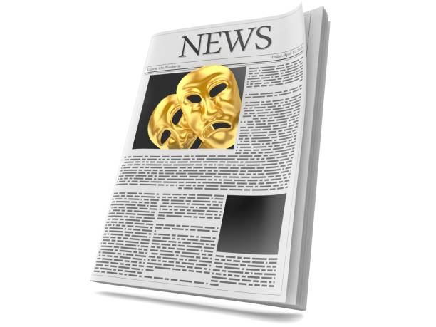 istock Theater Masks inside newspaper 1164964789