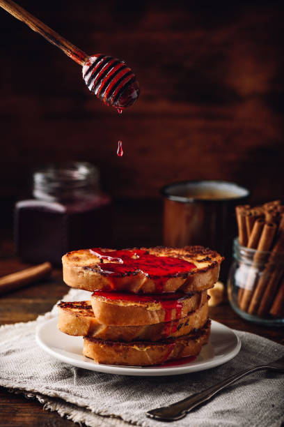 istock Stack of french toasts with berry syrup 1164966564