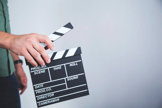 istock man hand movie sign 1164968394