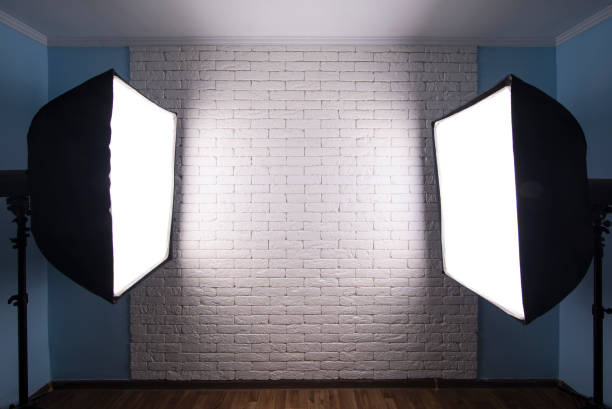 istock Interior of modern photo studio with  professional equipment ,white brick wall background 1164968452