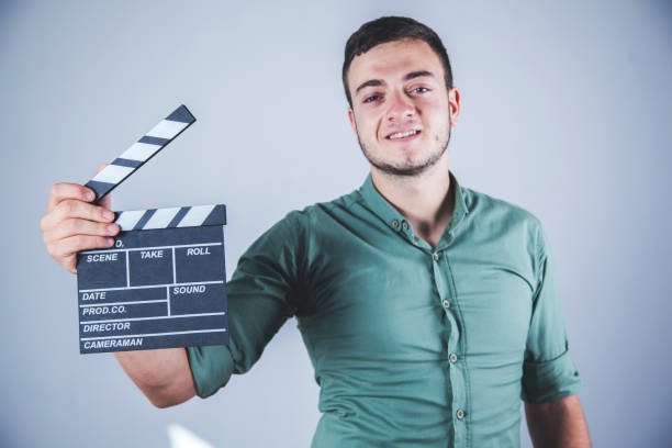 istock man hand movie sign 1164968473
