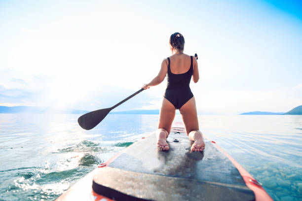 istock Female Traveling The Lake On A Paddleboard 1164971385