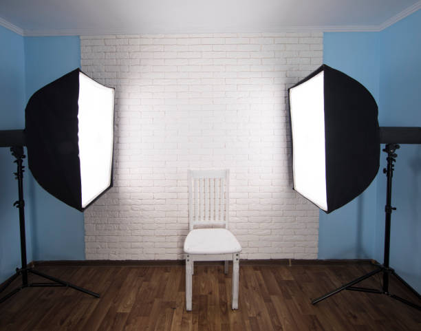 istock Interior of modern photo studio with  professional equipment ,white brick wall background 1164972538