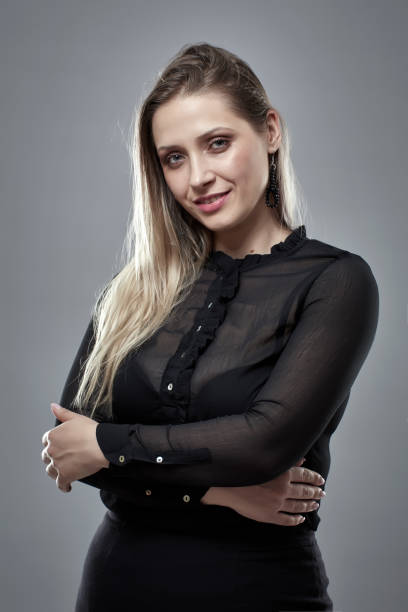 istock Pretty businesswoman on gray 1164977848