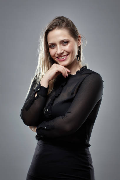 istock Pretty businesswoman on gray 1164977851