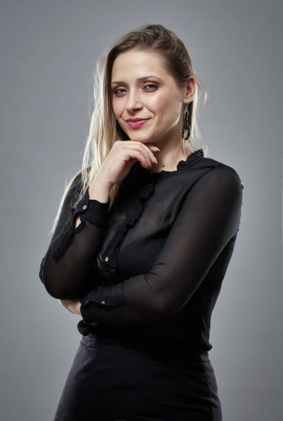 istock Pretty businesswoman on gray 1164977852