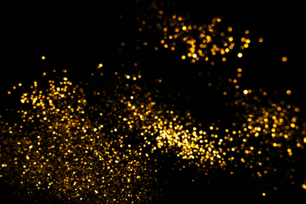 istock Golden abstract bokeh on black background. 1164977906