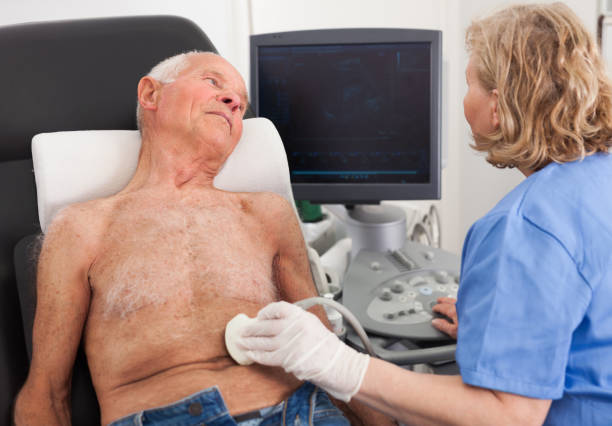 istock Female examines man with ultrasonic device 1164978193