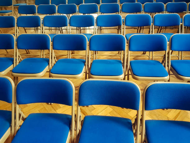 istock Blue chairs in a auditorium / lecture room 1164979536
