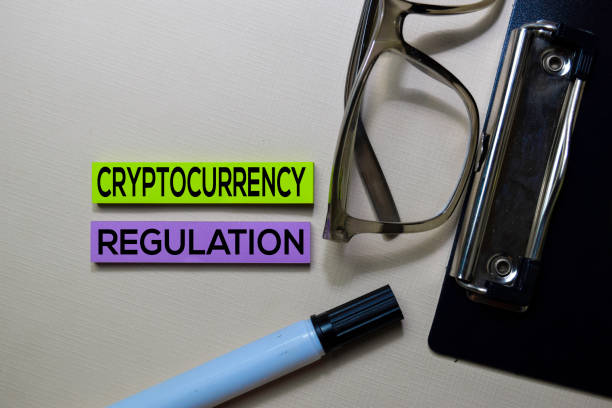 istock Cryptocurrency Regulation text on sticky notes isolated on office desk 1164980658
