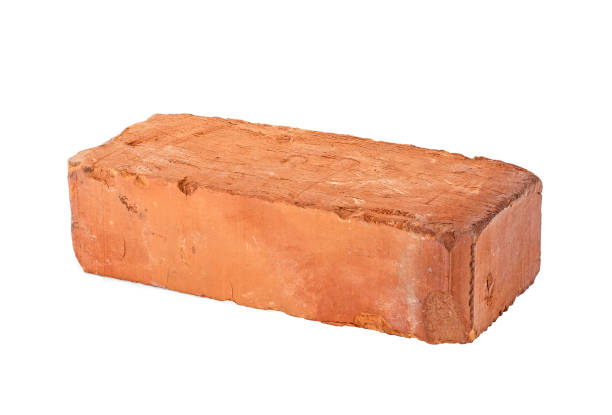 istock Old red brick isolated on white background. Old grungy clay brick. 1164981849