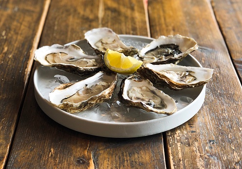 Plate Of Oysters Stock Photo - Download Image Now - Oyster, Animal Shell, Halved - iStock