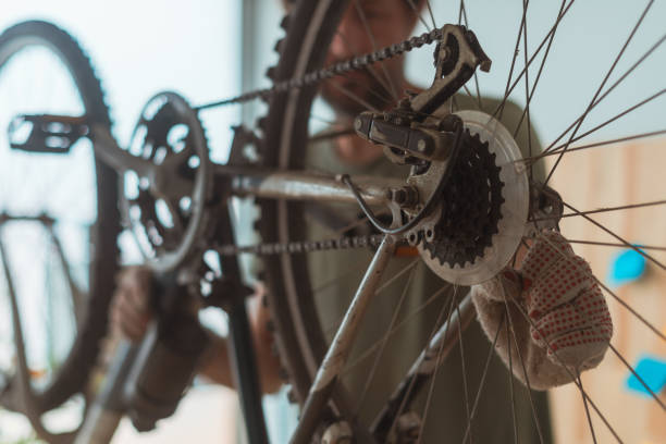 istock Man repairing old hardtail mountain bike in workshop 1164983698