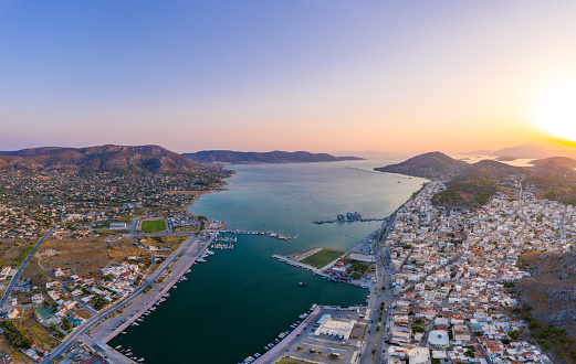 Aerial panoramic photo of the island of Salamis and the marina during sunset