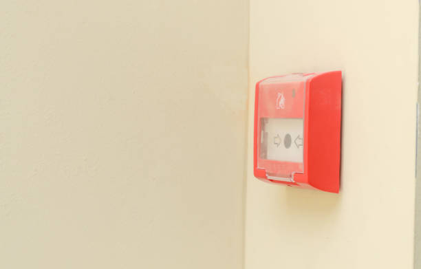 istock Fire alarm button on white wall.Fire safety for offices and shopping centers. 1164986185