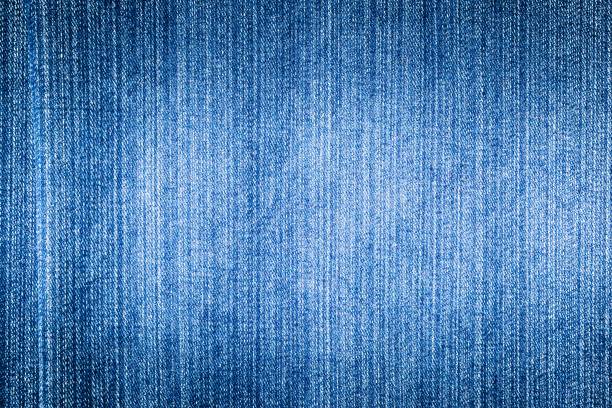 istock Texture of blue jeans with a white stripe background 1164987260