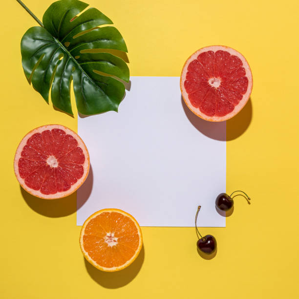 istock Creative fruit composition on yellow background with hard shadows. Summer minimal concept. 1164989477