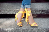Woman wearing yellow heels