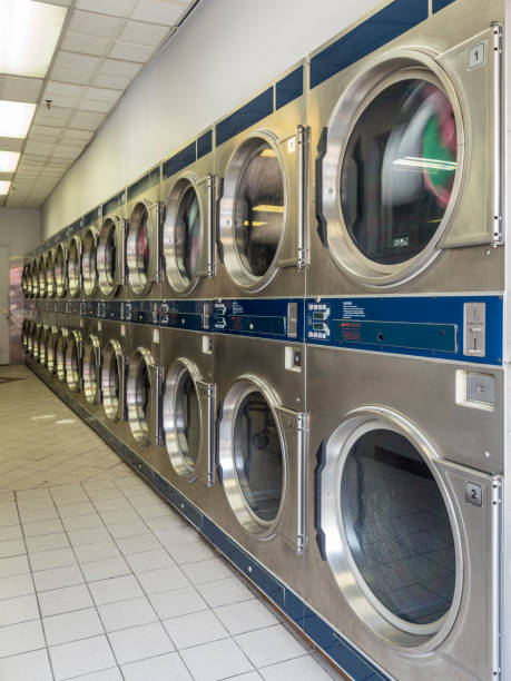 istock Washing Machines In Public Laundry 1164991203