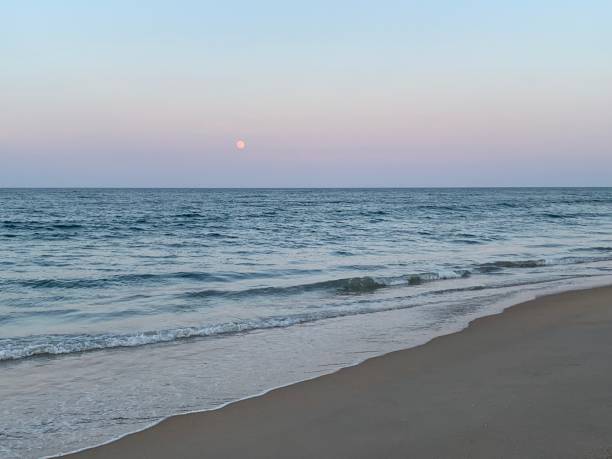 istock Moon Rising Over Sea 1164992591