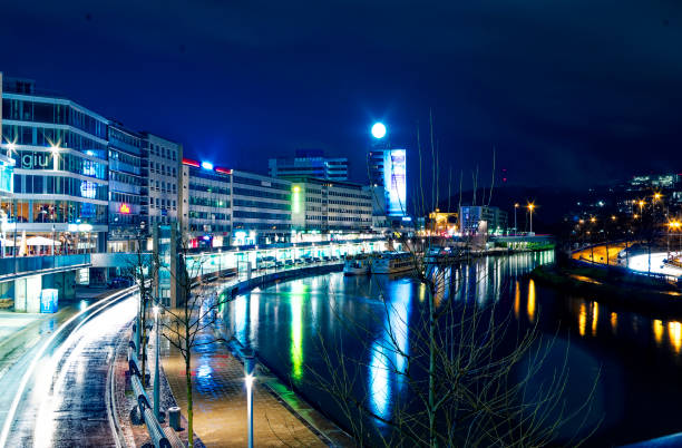 Night and city center in Saarbrücken Saarland Germany Europe with busy road on 2016.01.10 Night and downtown in Saarbrücken Saarland Germany Europe with busy street at 2016.01.10 blurred motion street car green stock pictures, royalty-free photos & images