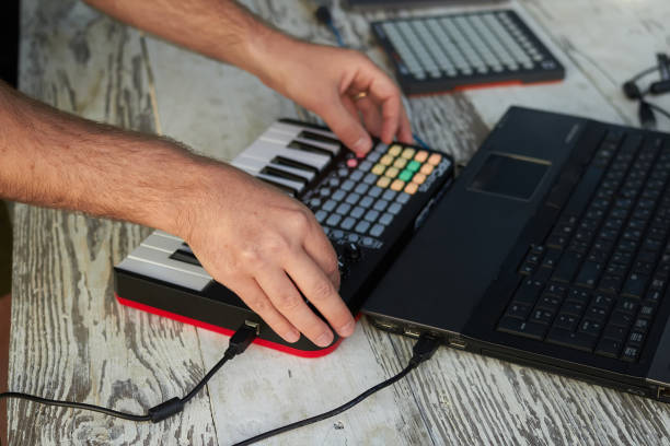 istock The DJ playing music at mixer closeup 1164994353
