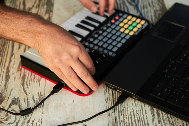 istock The DJ playing music at mixer closeup 1164994359