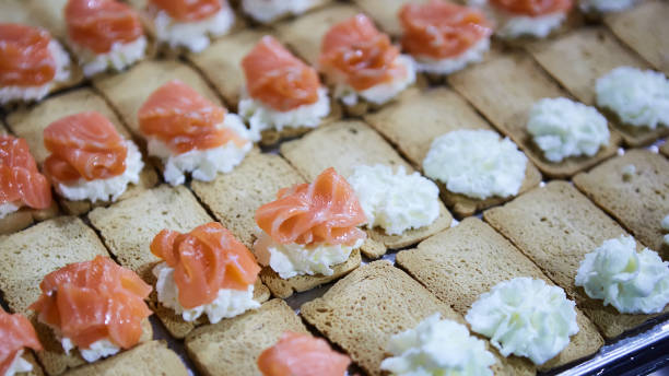 norwegian smoked salmon canapes with cream cheese - canape appetizer gourmet salmon imagens e fotografias de stock