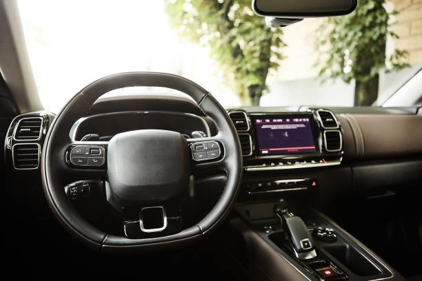 istock Modern luxury car Interior - steering wheel and dashboard. 1164994400