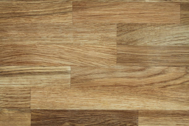 istock Light brown glued toned oak wooden background 1164995130