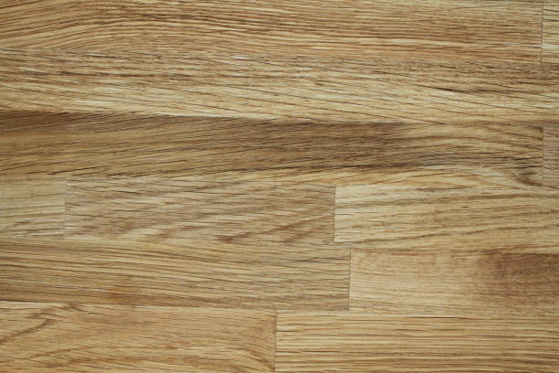 istock Light brown glued toned oak wooden background 1164995131