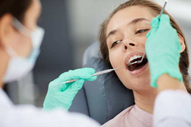 istock Young Woman at Dental Checkup 1164997119