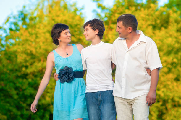 istock Family Spending There Time Together Embraced Outdoors. Horizontal Image 1165000886