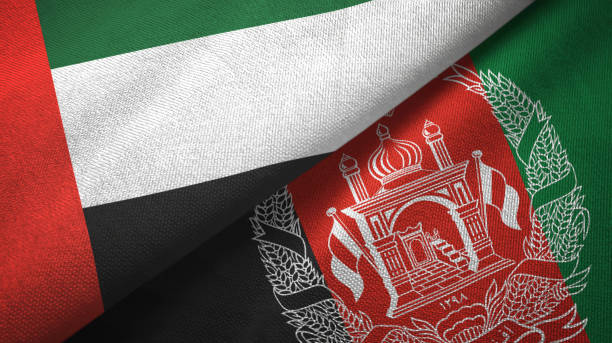 istock United Arab Emirates and Afghanistan two flags textile cloth, fabric texture 1165005160