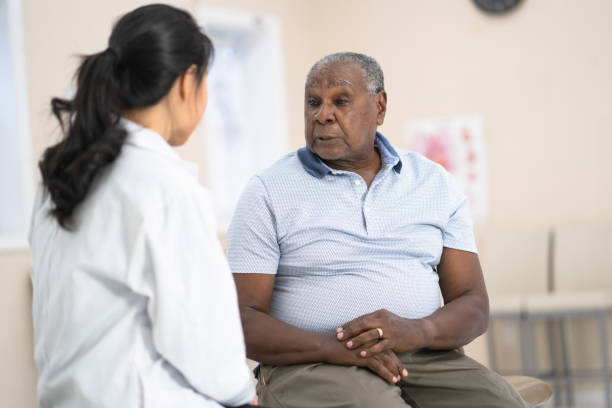 istock Senior man talking to doctor 1165005991