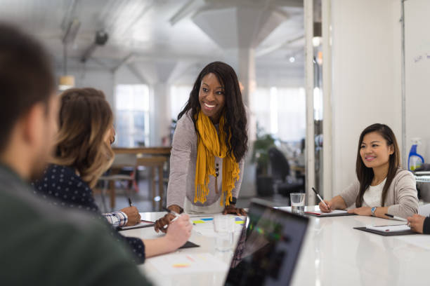 istock Black female CEO leads a team meeting 1165006231