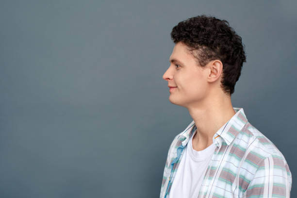 istock Man isolated on gray wall free style standing looking forward excited 1165006252