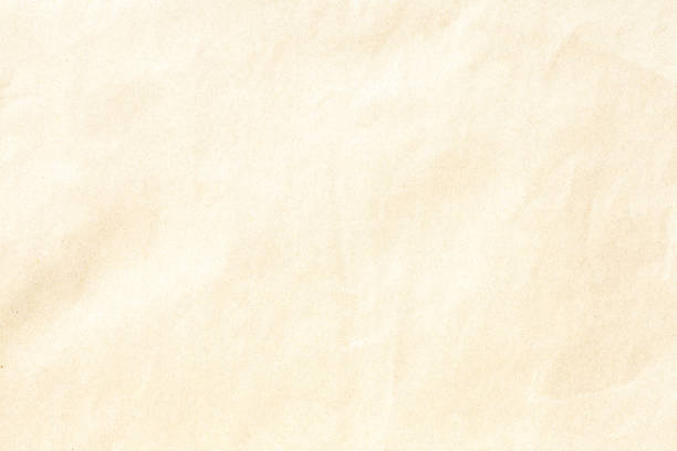 istock Crumpled old brown paper texture 1165006560